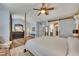 Comfortable main bedroom with hardwood floors, tray ceiling, ensuite bathroom and barn door at 139 Lake Reserve Way, Canton, GA 30115