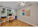 The bright office boasts natural light, a desk, a chair, and modern decor at 139 Lake Reserve Way, Canton, GA 30115