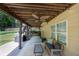 Covered patio area with ample seating, perfect for outdoor entertaining and a view of the yard at 139 Lake Reserve Way, Canton, GA 30115