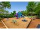 Fun community playground with swings, slides, and climbing structures in a wooded area at 139 Lake Reserve Way, Canton, GA 30115