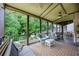 Inviting screened porch with stylish furniture and outdoor scenery at 139 Lake Reserve Way, Canton, GA 30115