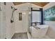 Beautiful bathroom with walk-in shower, soaking tub and picture window at 139 Lake Reserve Way, Canton, GA 30115