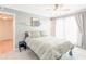 Cozy bedroom with light gray walls, a ceiling fan, and access to a private outdoor space at 1445 Monroe Ne Dr # F18, Atlanta, GA 30324