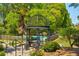Beautiful gazebo overlooking a pool, surrounded by lush landscaping and mature trees at 1445 Monroe Ne Dr # F18, Atlanta, GA 30324