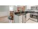 Open kitchen with stainless steel appliances, granite countertops, and adjacent dining area at 1445 Monroe Ne Dr # F18, Atlanta, GA 30324