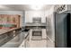 Well-equipped kitchen features stainless steel appliances and granite countertops at 1445 Monroe Ne Dr # F18, Atlanta, GA 30324