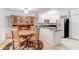 Bright eat-in kitchen with white cabinets, stainless steel appliances, and a built-in wine rack at 1445 Monroe Ne Dr # F18, Atlanta, GA 30324