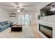 Comfortable living room offers backyard access via glass pane doors and features a fireplace at 1445 Monroe Ne Dr # F18, Atlanta, GA 30324