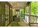 Cozy screened patio with comfortable seating and string lights, perfect for relaxing outdoors at 1445 Monroe Ne Dr # F18, Atlanta, GA 30324