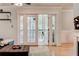 Glass pane doors lead to backyard patio, allowing for bright and open living space at 1445 Monroe Ne Dr # F18, Atlanta, GA 30324