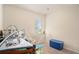 This cozy room features a crib and an ironing board, offering comfort and functionality at 1907 Sea Oats Dr, Hampton, GA 30228