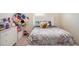 Colorful bedroom features a comfortable bed and lots of natural light at 1907 Sea Oats Dr, Hampton, GA 30228