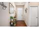 Inviting entryway with hardwood floors, decor accents, light walls, bright lighting and white doors at 1907 Sea Oats Dr, Hampton, GA 30228