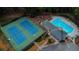 Aerial view of the tennis courts and pool; perfect for recreation and outdoor activities at 5440 Cameron Forest Pkwy, Johns Creek, GA 30022