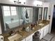 Bathroom featuring dual sinks, granite counters, vanity, and a soaking tub at 5440 Cameron Forest Pkwy, Johns Creek, GA 30022