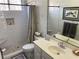 Updated bathroom featuring a tiled shower with built-in niche, modern fixtures, and neutral decor at 5440 Cameron Forest Pkwy, Johns Creek, GA 30022