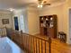 Interior view of the staircase landing with hardwood floors and a built-in bookcase at 5440 Cameron Forest Pkwy, Johns Creek, GA 30022