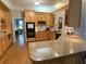 Well-maintained kitchen featuring hardwood floors, modern appliances and seamless flow into the living area at 5440 Cameron Forest Pkwy, Johns Creek, GA 30022