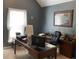 Bright office space with a large window, functional desk setup, and neutral carpet flooring at 5440 Cameron Forest Pkwy, Johns Creek, GA 30022