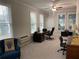 Bright home office with carpet, desk, and lots of natural light at 5440 Cameron Forest Pkwy, Johns Creek, GA 30022