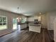 Modern kitchen featuring an island, stainless steel appliances, and ample cabinet space at 55 Barton Ln, Covington, GA 30016