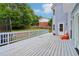 Back deck with white railing and access to the backyard at 771 James Cir, Lawrenceville, GA 30046