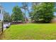 A large, green backyard that is perfect for recreation and entertaining at 771 James Cir, Lawrenceville, GA 30046
