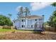 Expansive backyard features a trampoline and gray deck perfect for entertainment at 771 James Cir, Lawrenceville, GA 30046