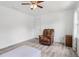 Bedroom featuring chair, gray flooring, and natural light from the window at 771 James Cir, Lawrenceville, GA 30046