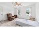 Cozy bedroom with neutral walls, gray floors, and plenty of natural light from windows at 771 James Cir, Lawrenceville, GA 30046