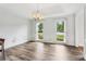 Dining area featuring hardwood floors, wainscoting detail, and bright windows at 771 James Cir, Lawrenceville, GA 30046