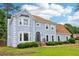 Light blue two-story home with a well-kept lawn on a sunny day at 771 James Cir, Lawrenceville, GA 30046