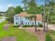 Charming light blue two-story home with well-manicured lawn and mature trees in a desirable neighborhood at 771 James Cir, Lawrenceville, GA 30046