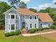 Charming two-story home with a bay window, manicured landscaping, and a welcoming front entrance at 771 James Cir, Lawrenceville, GA 30046