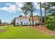 Large two-story home with lush lawn and mature trees on a spacious lot at 771 James Cir, Lawrenceville, GA 30046