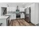 Beautiful kitchen with stainless steel appliances, shaker cabinets, and modern backsplash at 771 James Cir, Lawrenceville, GA 30046