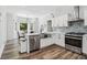 Updated kitchen with stainless appliances, quartz counters, and stainless steel faucet at 771 James Cir, Lawrenceville, GA 30046