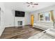 Inviting living room with modern flooring, fresh paint, a fireplace, and comfortable seating at 771 James Cir, Lawrenceville, GA 30046