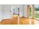 Bright living room with hardwood floors, white walls, and a view of the front yard at 771 James Cir, Lawrenceville, GA 30046