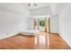 Spacious main bedroom with hardwood floors, a ceiling fan, and a large bay window at 771 James Cir, Lawrenceville, GA 30046