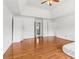 Spacious main bedroom with hardwood floors, a ceiling fan, and a doorway to the bathroom at 771 James Cir, Lawrenceville, GA 30046