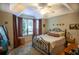 Bright bedroom features a ceiling fan, tray ceilings, and a large window for ample natural light at 1025 Mcgill Park Ne Ave, Atlanta, GA 30312