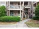 Exterior view of a building with stairways leading up to the residential units at 1025 Mcgill Park Ne Ave, Atlanta, GA 30312