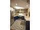 Renovated kitchen featuring stainless steel appliances, custom cabinetry, and designer tile floor at 1025 Mcgill Park Ne Ave, Atlanta, GA 30312