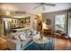 Open concept living room into kitchen with hardwood floors and lots of light at 1025 Mcgill Park Ne Ave, Atlanta, GA 30312