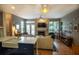 Open concept living room with fireplace flowing into the kitchen at 1025 Mcgill Park Ne Ave, Atlanta, GA 30312