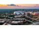 Panoramic aerial view of the city skyline and stadium, set against a vibrant sunset at 250 Castleberry Station Sw Dr, Atlanta, GA 30313
