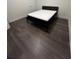 Modern bedroom featuring sleek hardwood floors and a bed with a comfortable mattress at 250 Castleberry Station Sw Dr, Atlanta, GA 30313