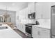 Well-lit modern kitchen features quartz countertops and stainless steel appliances at 250 Castleberry Station Sw Dr, Atlanta, GA 30313