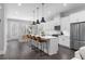 Bright, open kitchen with a center island, stainless appliances, and eat-in dining area at 250 Castleberry Station Sw Dr, Atlanta, GA 30313
